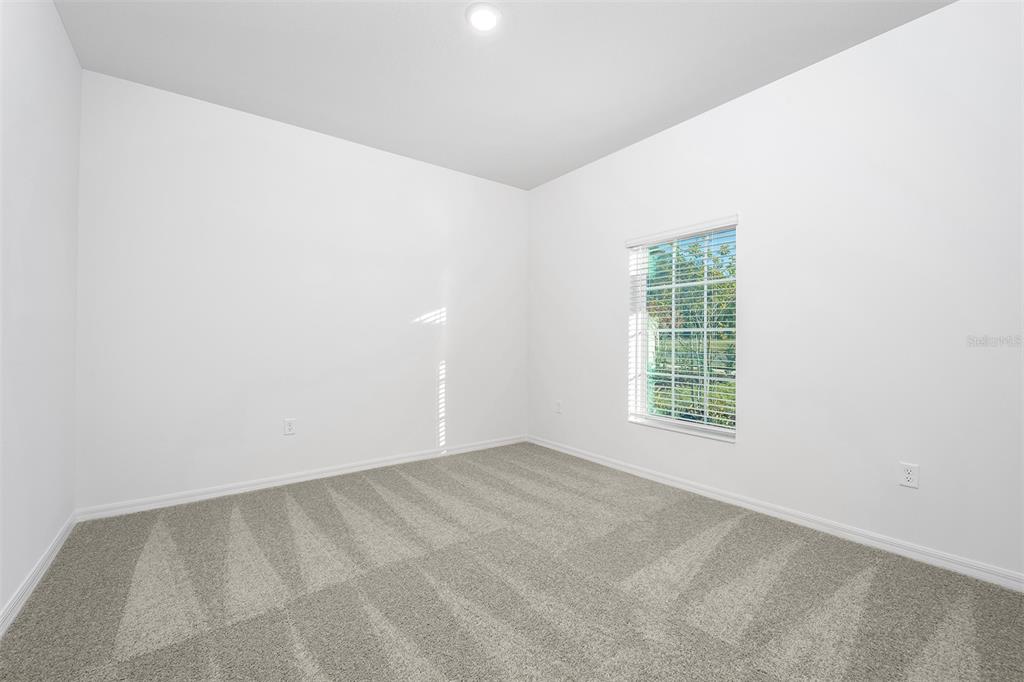 13340 Tula Loop Astatula, FL 34705 - Photo 8 of 21 an empty room with windows