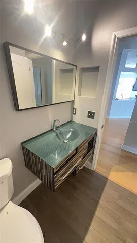 a room with pool table and windows