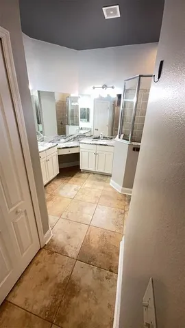 a bathroom with a sink a mirror and a toilet