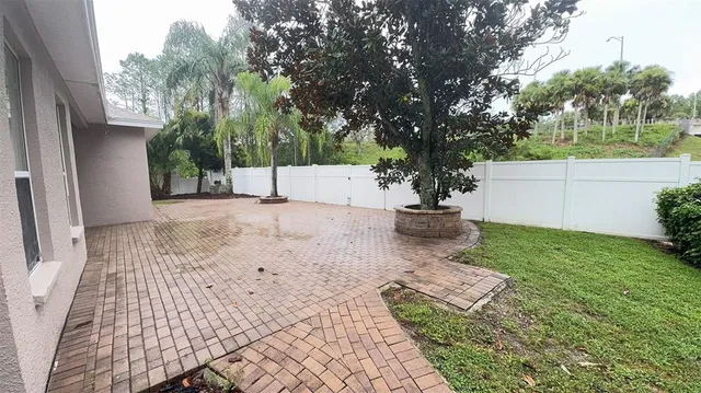 a view of a backyard of the house