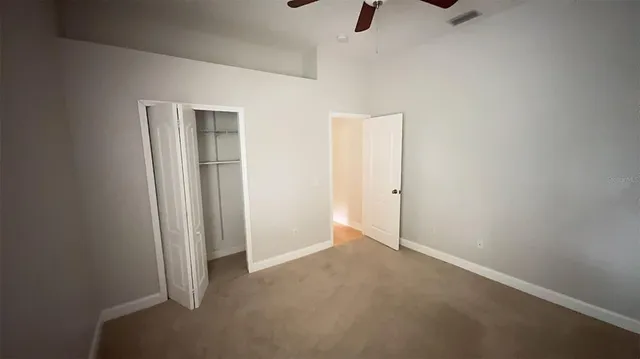 an empty room with a empty space and windows