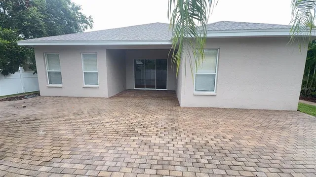 a view of backyard of a house