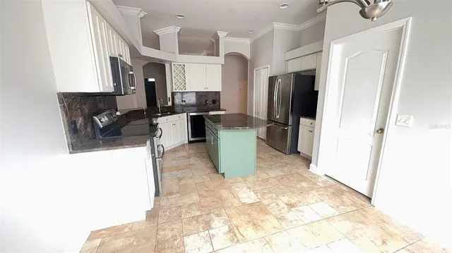 a view of a kitchen with a sink