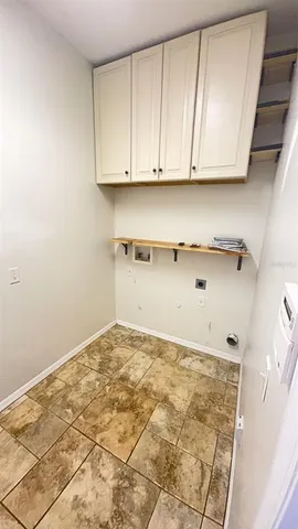 a view of a kitchen with granite countertop cabinets