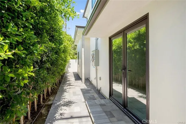 a view of a pathway both side of a house