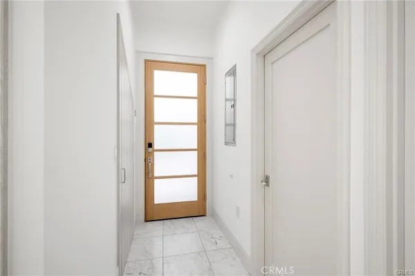 a view of an empty room with a window