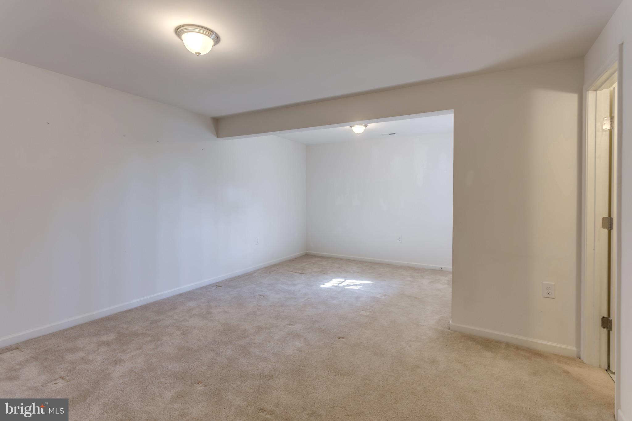 338 Rumbling Rock Road Hedgesville, WV 25427 - Photo 23 of 28 Lower level bedroom 4/rec room