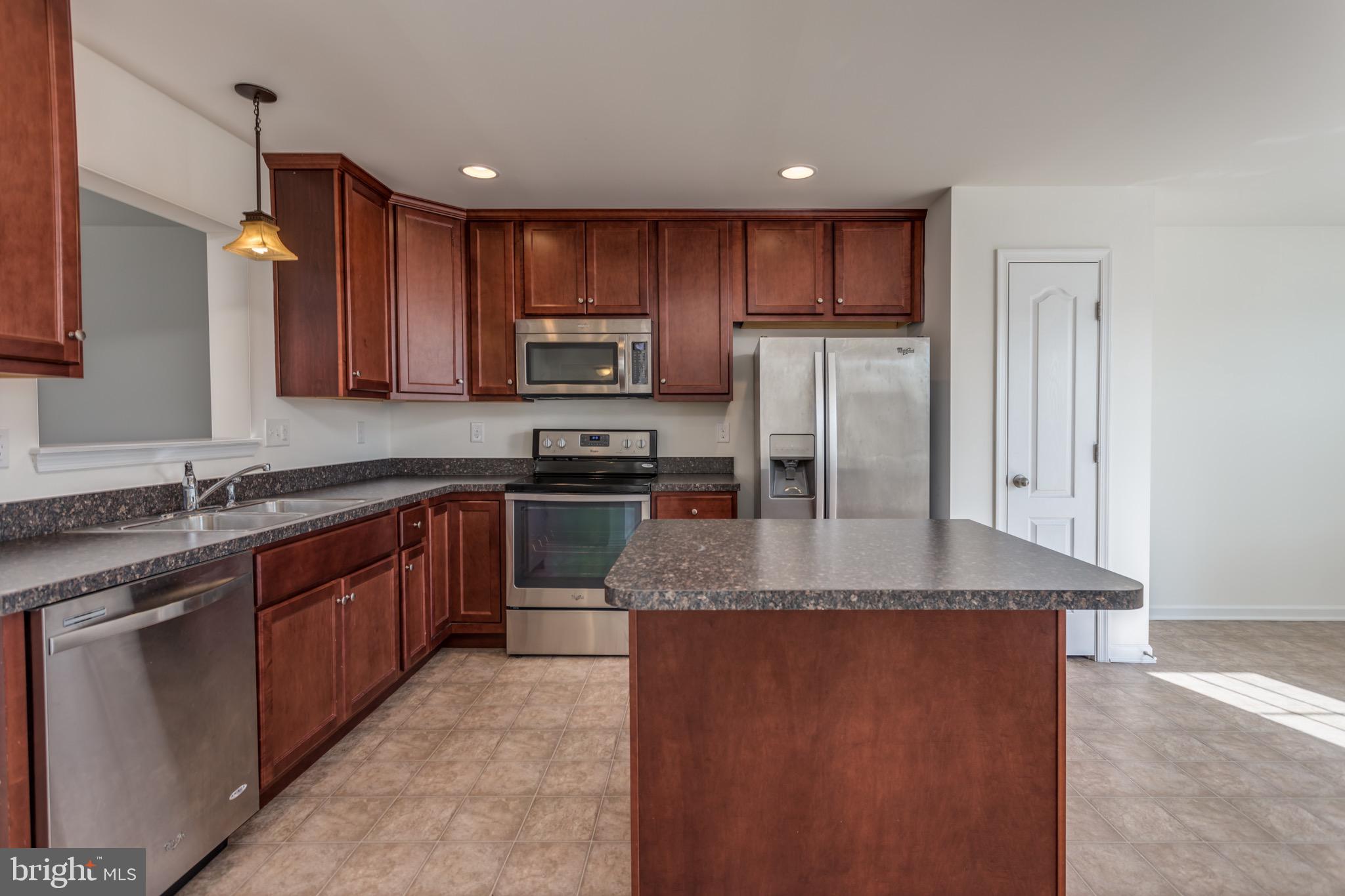 338 Rumbling Rock Road Hedgesville, WV 25427 - Photo 9 of 28 Stainless appliances and island
