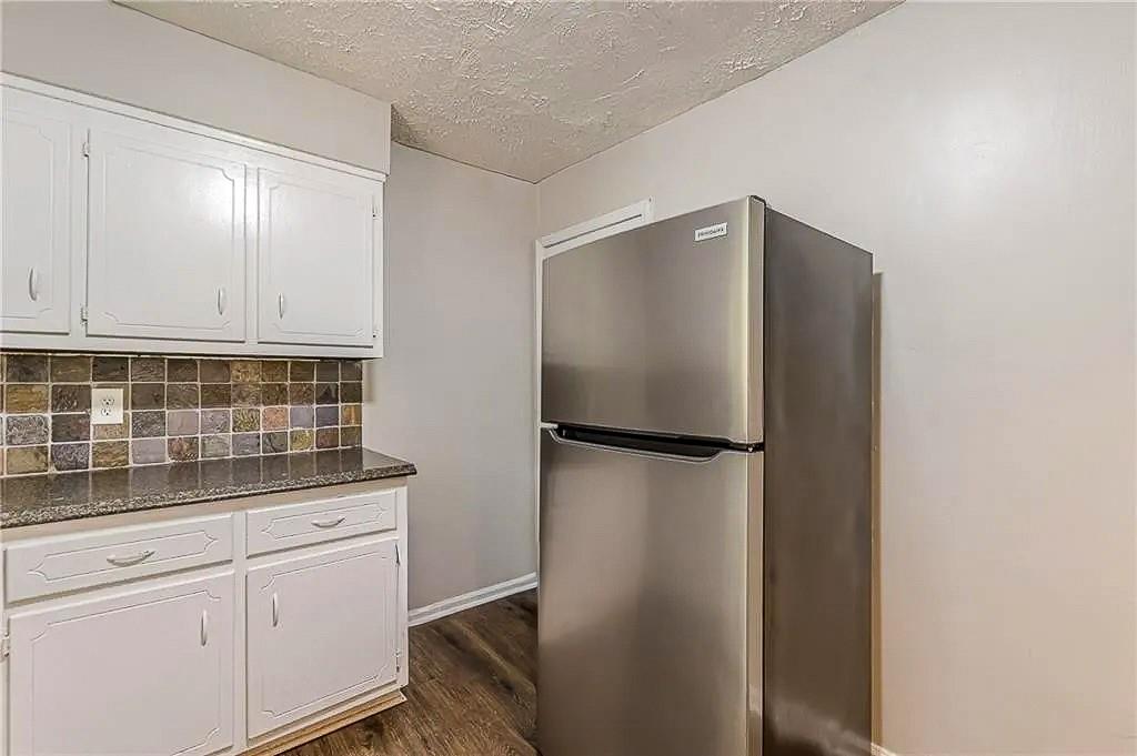 3661 Boring Road Decatur, GA 30034 - Photo 11 of 41 a white refrigerator freezer sitting inside of a kitchen