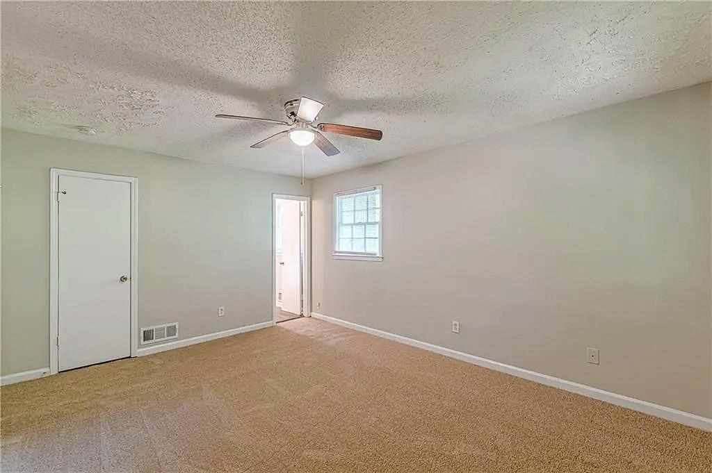 3661 Boring Road Decatur, GA 30034 - Photo 19 of 41 an empty room with windows and fan