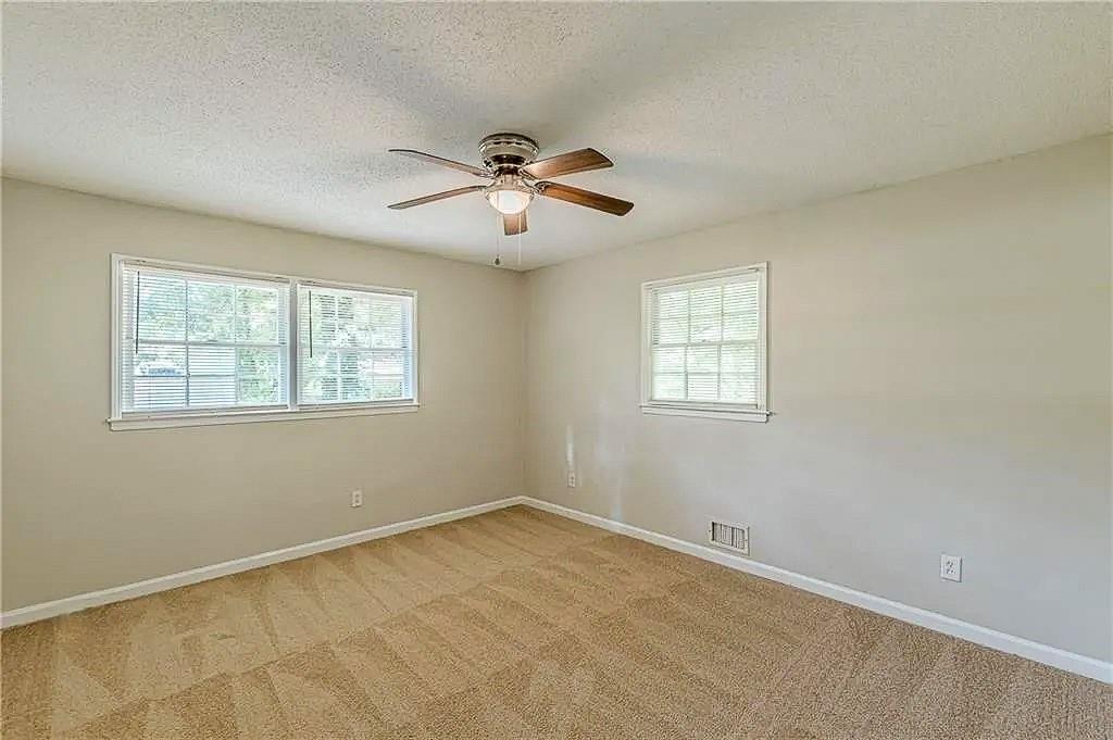 3661 Boring Road Decatur, GA 30034 - Photo 25 of 41 a view of room with a ceiling fan and hardwood floor