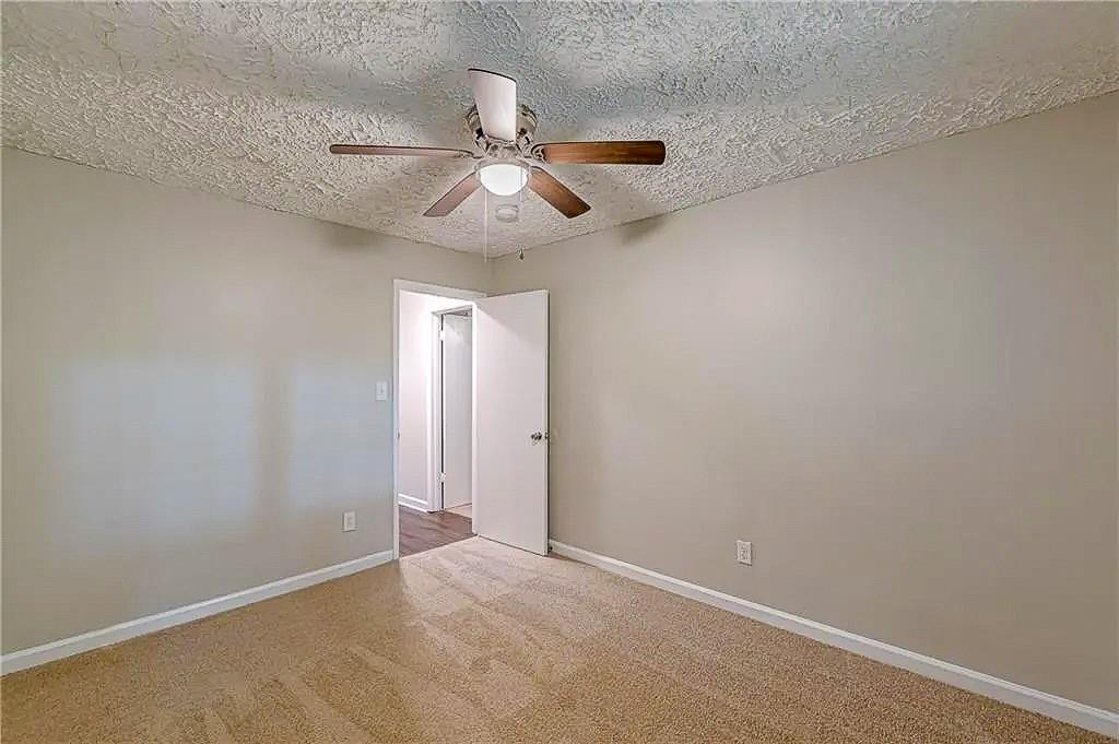 3661 Boring Road Decatur, GA 30034 - Photo 26 of 41 an empty room with a window and a fan