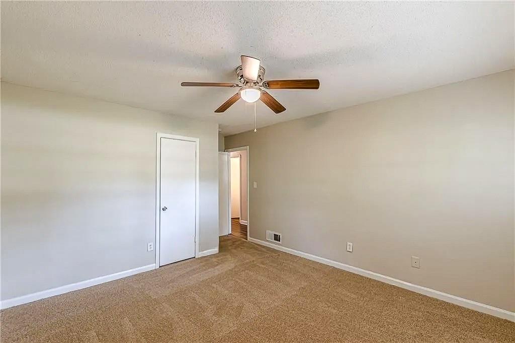 3661 Boring Road Decatur, GA 30034 - Photo 31 of 41 a view of a room with a ceiling fan and a chandelier fan