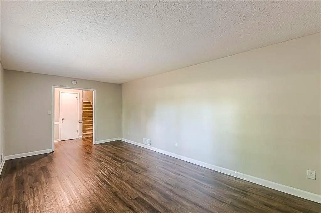 3661 Boring Road Decatur, GA 30034 - Photo 5 of 41 an empty room with wooden floor and windows