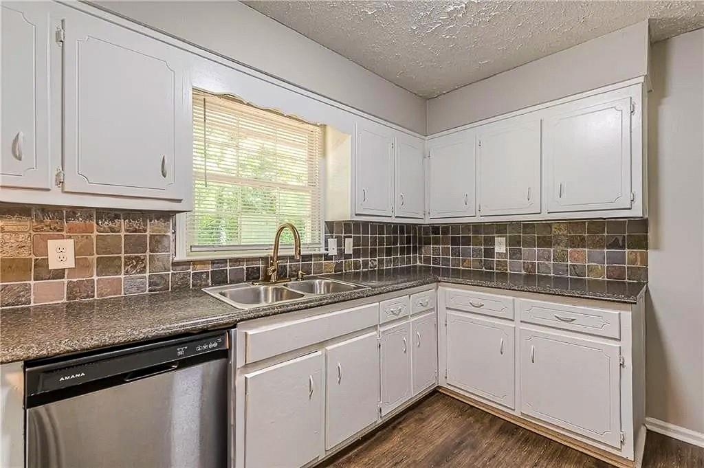 3661 Boring Road Decatur, GA 30034 - Photo 9 of 41 a kitchen with a sink stove and cabinets