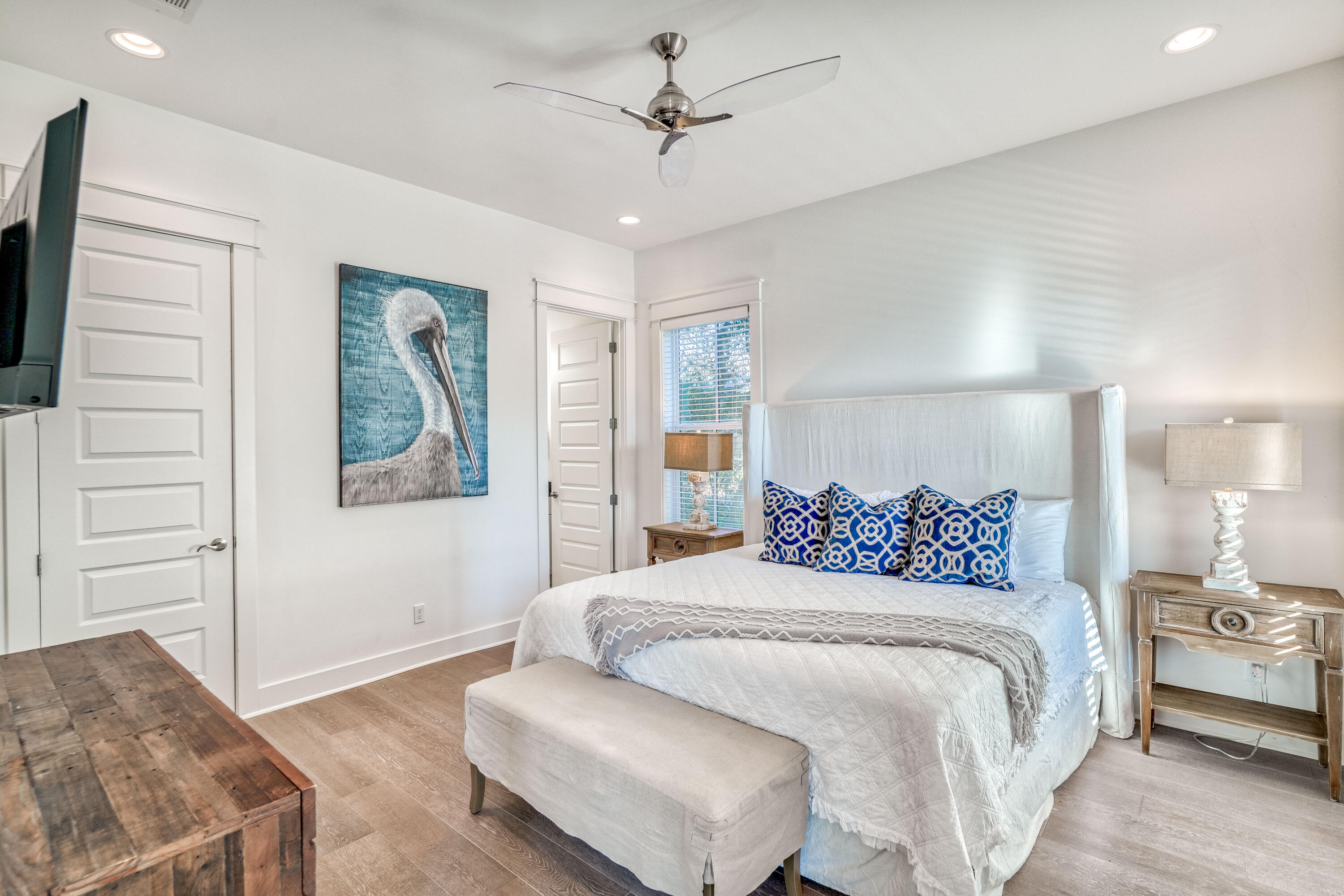 101 A St Inlet Beach Inlet Beach, FL 32461 - Photo 19 of 47 a bedroom with a large bed a chandelier and a couch