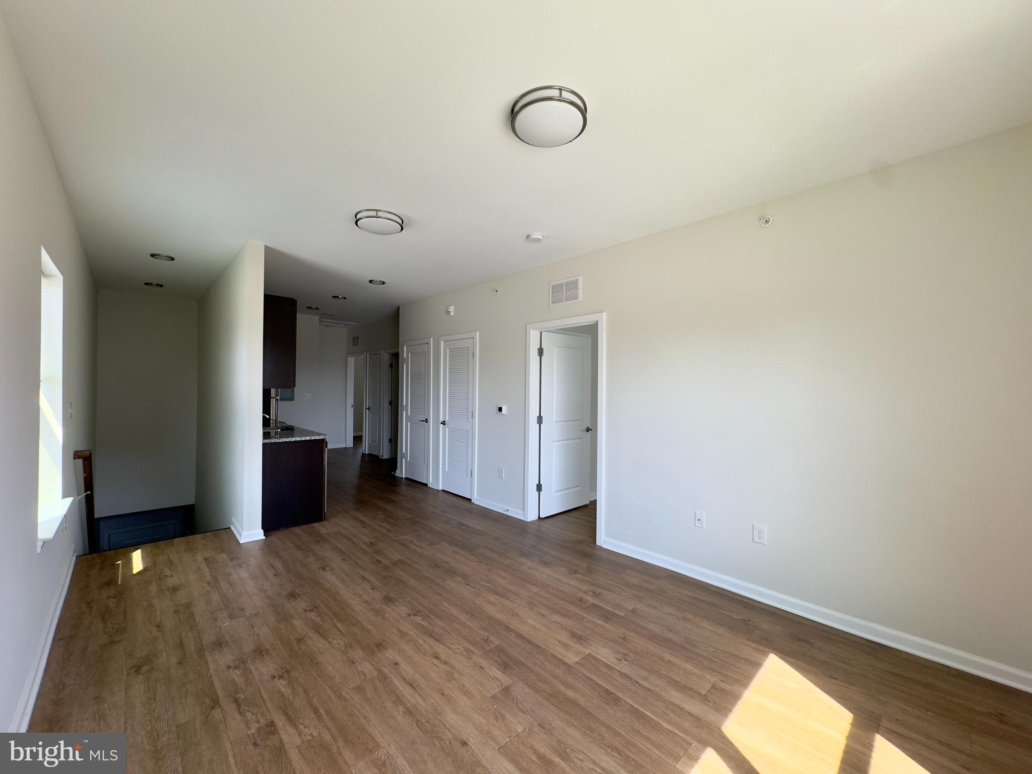 4901 Hamilton Avenue, Unit 4901B Baltimore, MD 21206 - Photo 3 of 10 a view of empty room with wooden floor