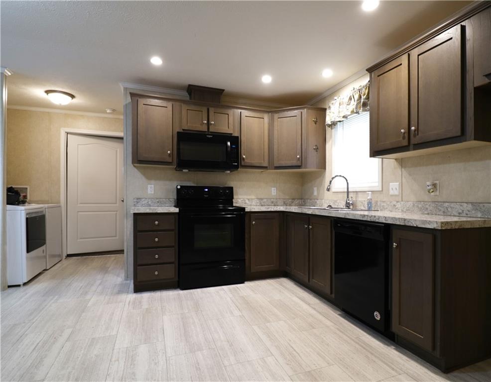 355 Route 30, Unit 89 Clinton, PA 15026 - Photo 2 of 13 a kitchen with granite countertop a refrigerator and a stove top oven