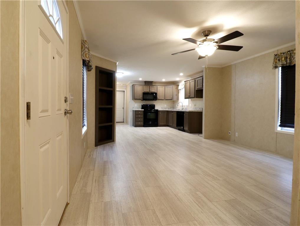 355 Route 30, Unit 89 Clinton, PA 15026 - Photo 3 of 13 a view of a kitchen with a sink and a refrigerator