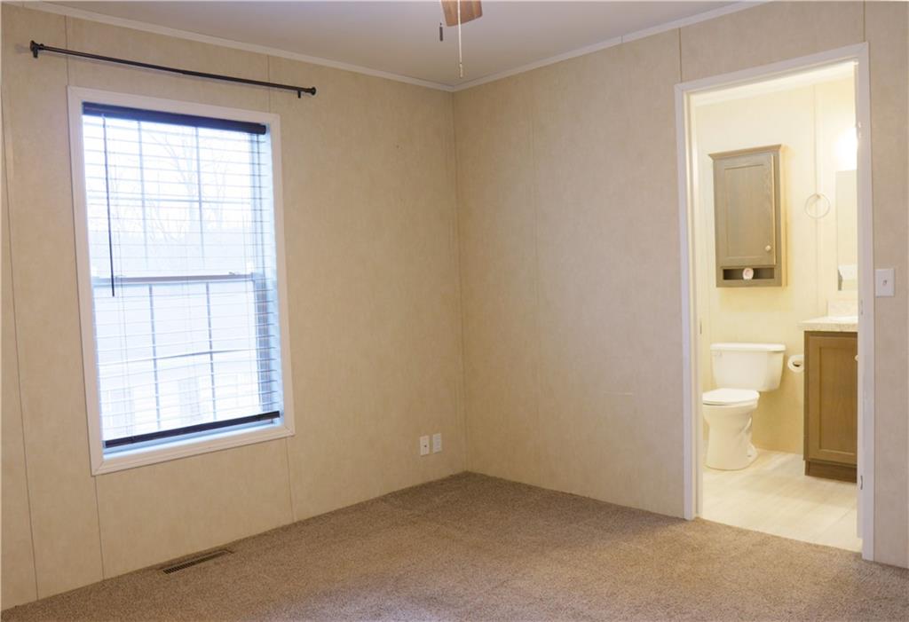 355 Route 30, Unit 89 Clinton, PA 15026 - Photo 5 of 13 an empty room and a bathroom with a toilet