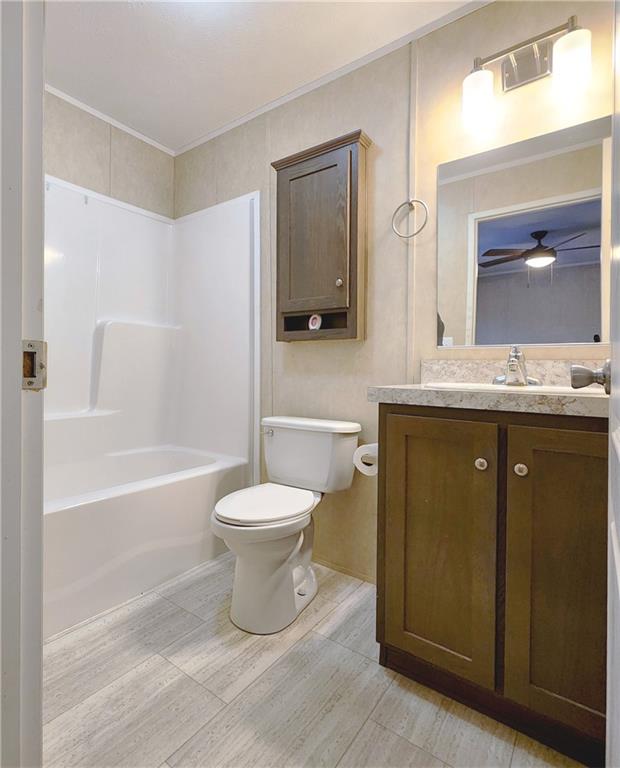 355 Route 30, Unit 89 Clinton, PA 15026 - Photo 7 of 13 a bathroom with a granite countertop toilet a sink and bathtub