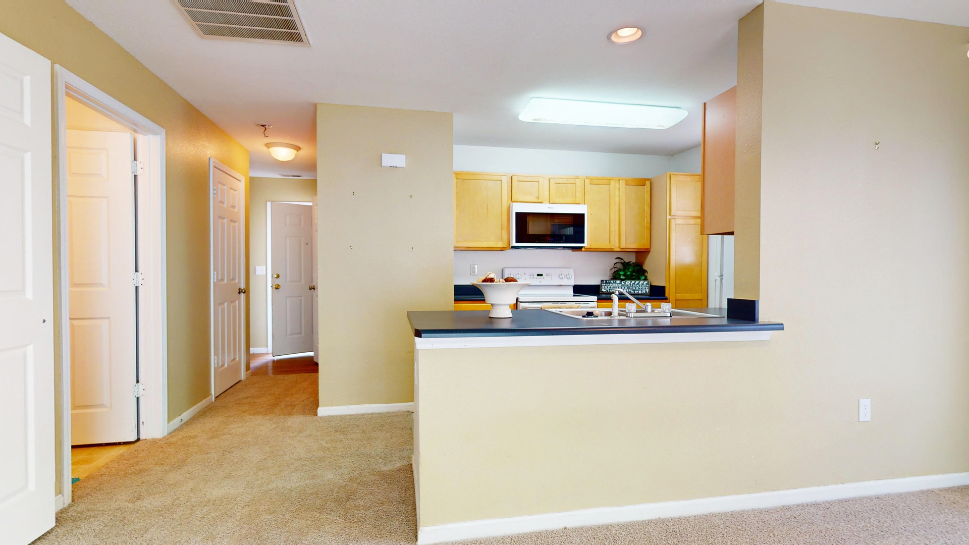 609 Corey Lane Champaign, IL 61822 - Photo 3 of 10 a kitchen with stainless steel appliances a stove top oven a sink and a refrigerator