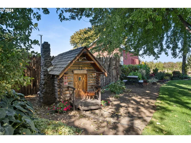 a view of a backyard with seating area