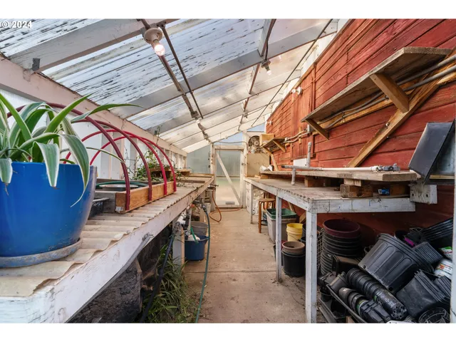 a kitchen that has a lot of cabinets a sink and a stove in it