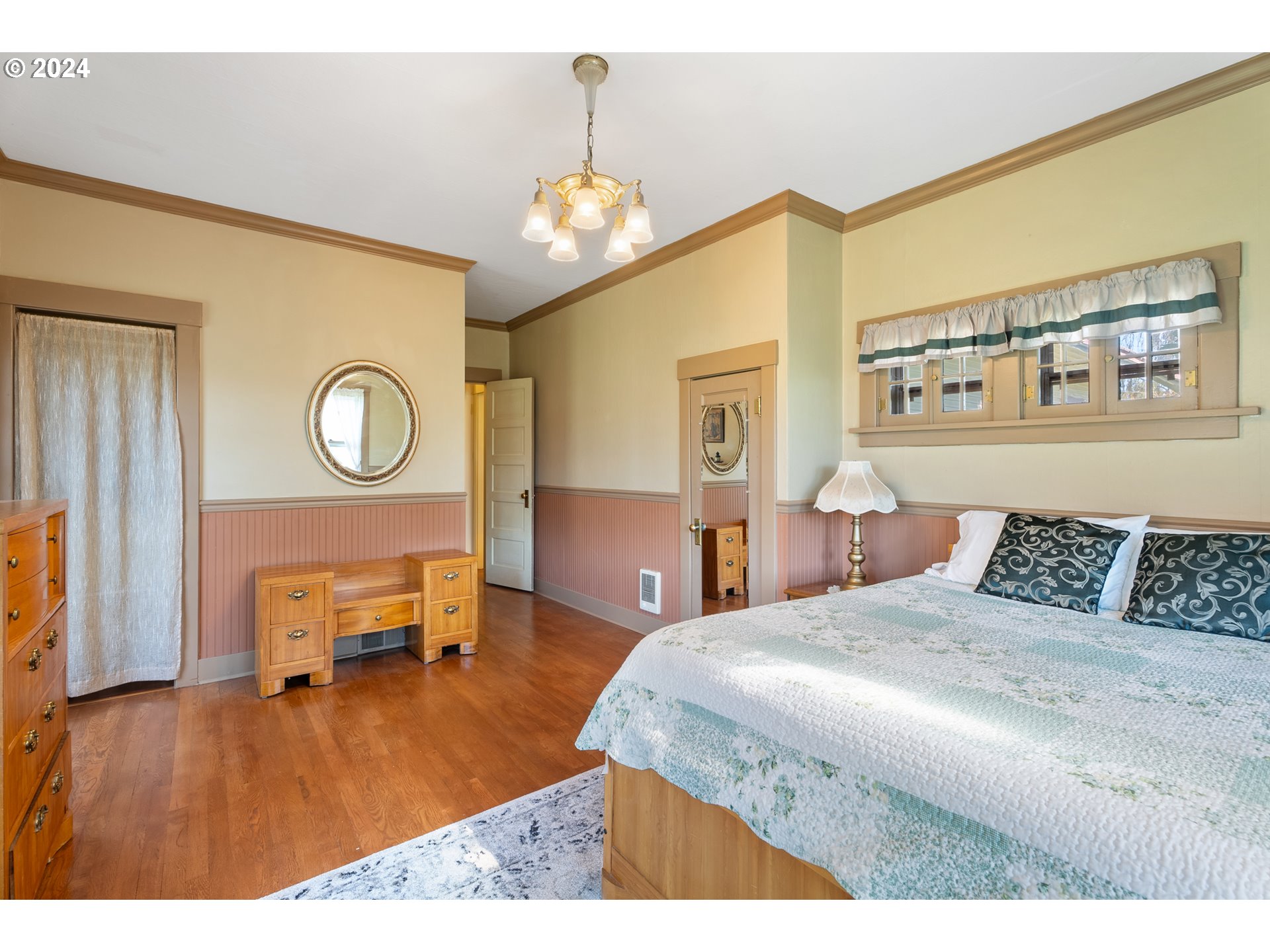 84768 Eastside Road Milton Freewater, OR 97862 - Photo 29 of 43 a bedroom with a bed and dresser with wooden floor