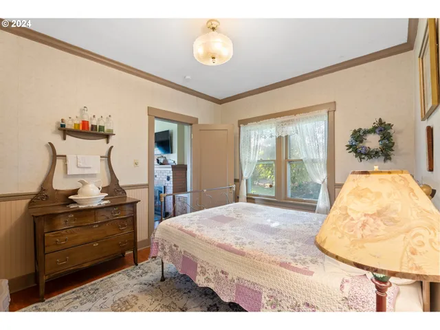 a dining room with furniture window and wooden floor