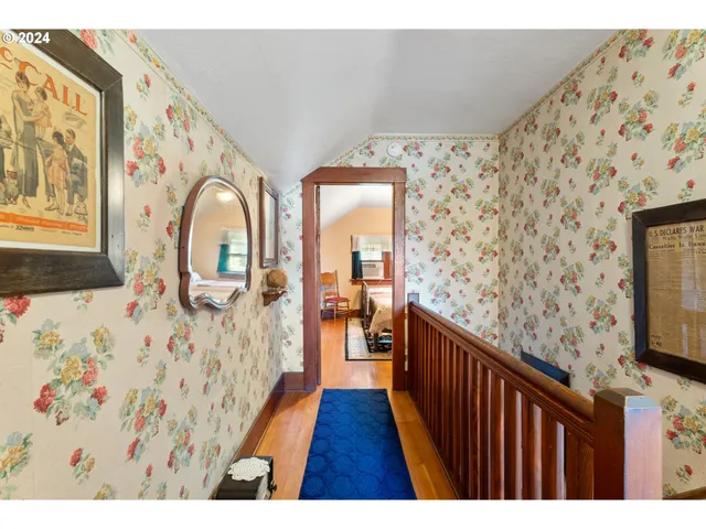 a bedroom with a bed a couch and dresser