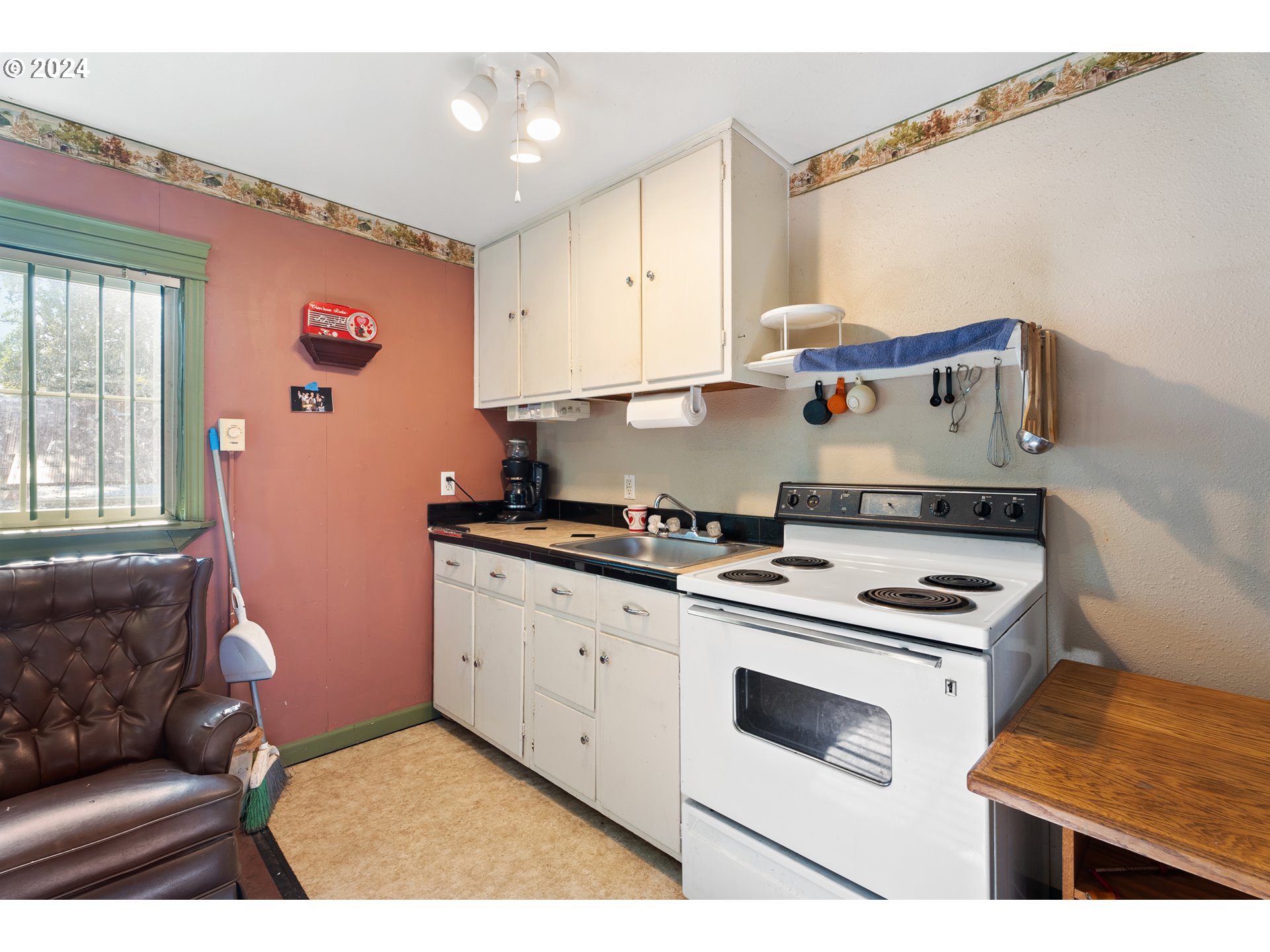 84768 Eastside Road Milton Freewater, OR 97862 - Photo 42 of 43 a kitchen with stainless steel appliances granite countertop a stove a sink and a refrigerator