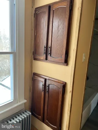 a kitchen with a refrigerator a stove a microwave and cabinets