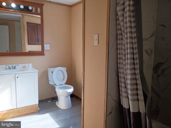 a bathroom with a toilet and a sink
