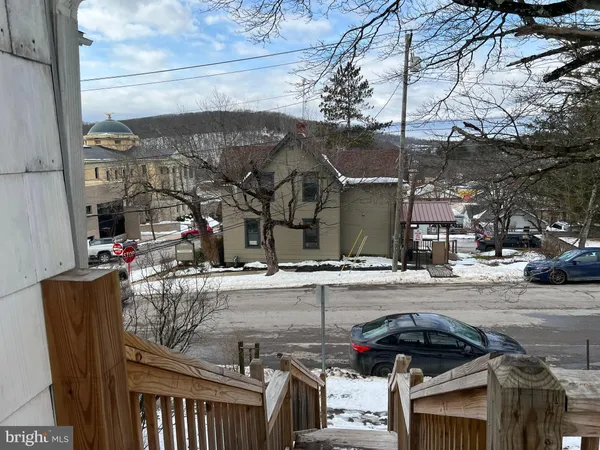 a view of a street with cars