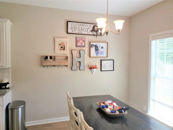 a view of a livingroom with furniture and a workspace