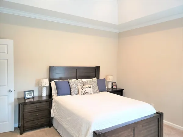 a bathroom with a granite countertop double vanity sink and a mirror