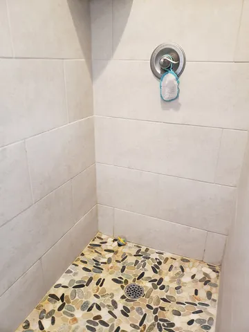 a bedroom with a bed and a lamp