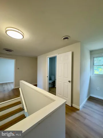 wooden floor in a hall with an entryway