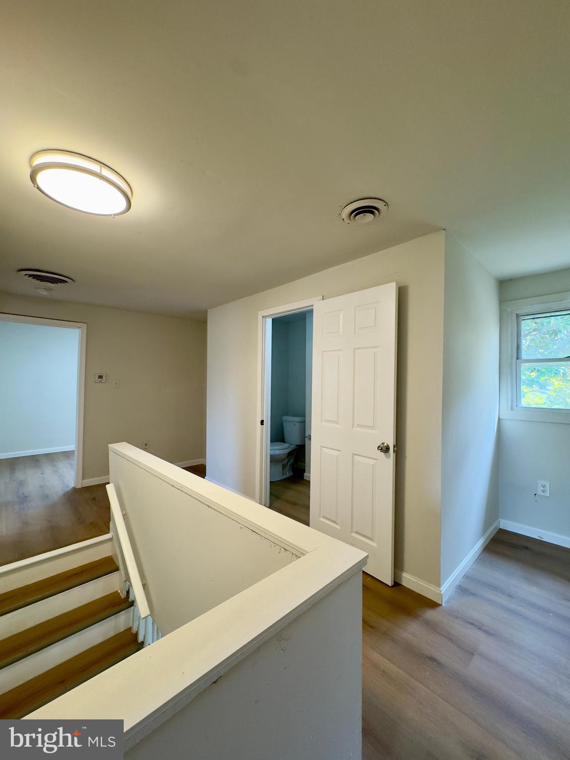 815 Seneca Park Road Middle River, MD 21220 - Photo 12 of 23 a view of an empty room with wooden floor