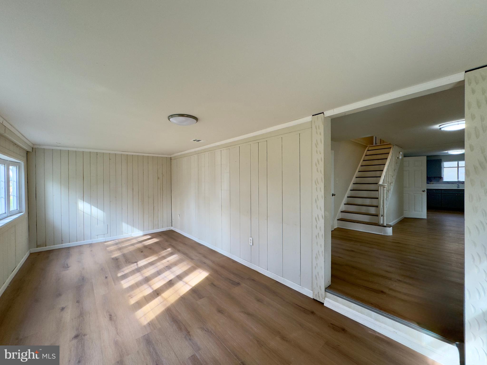 815 Seneca Park Road Middle River, MD 21220 - Photo 20 of 23 a view of a hallway with wooden floor and stairs