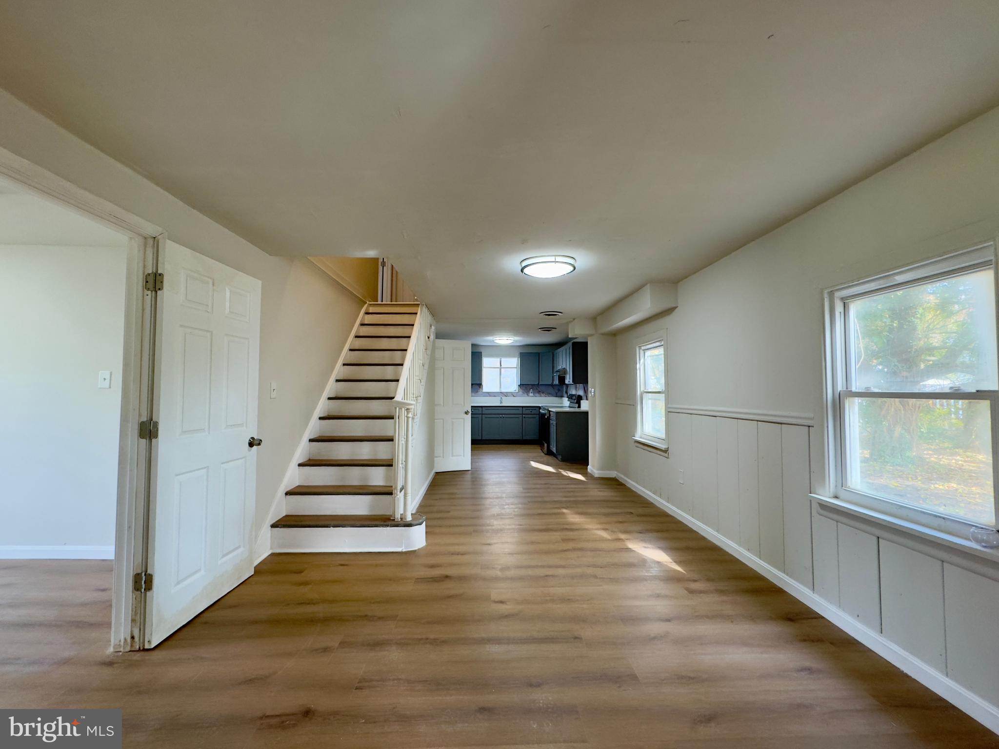 815 Seneca Park Road Middle River, MD 21220 - Photo 21 of 23 a view of a hallway with stairs and wooden floor