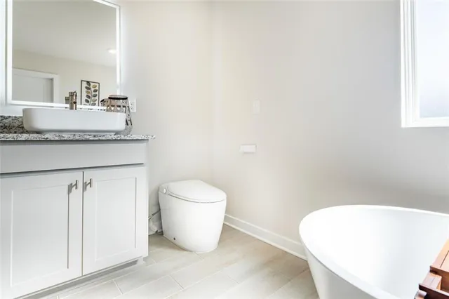a bathroom with a toilet and a sink