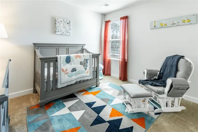 a living room with furniture and a rug
