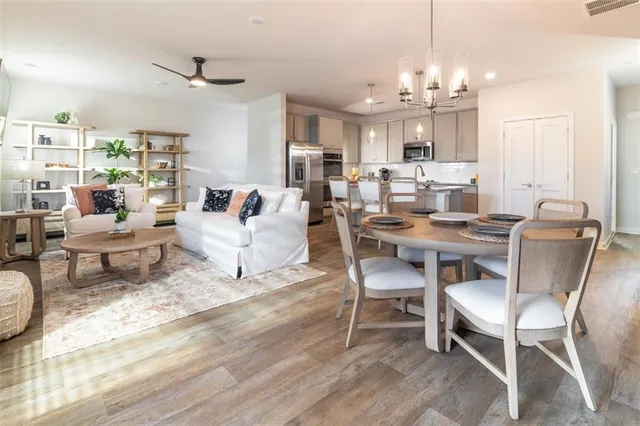 a view of a dining room with furniture window and wooden floor