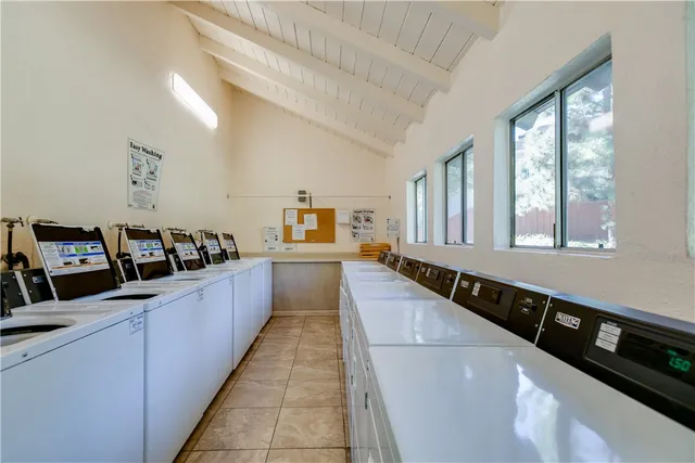 a large white kitchen with lots of counter space