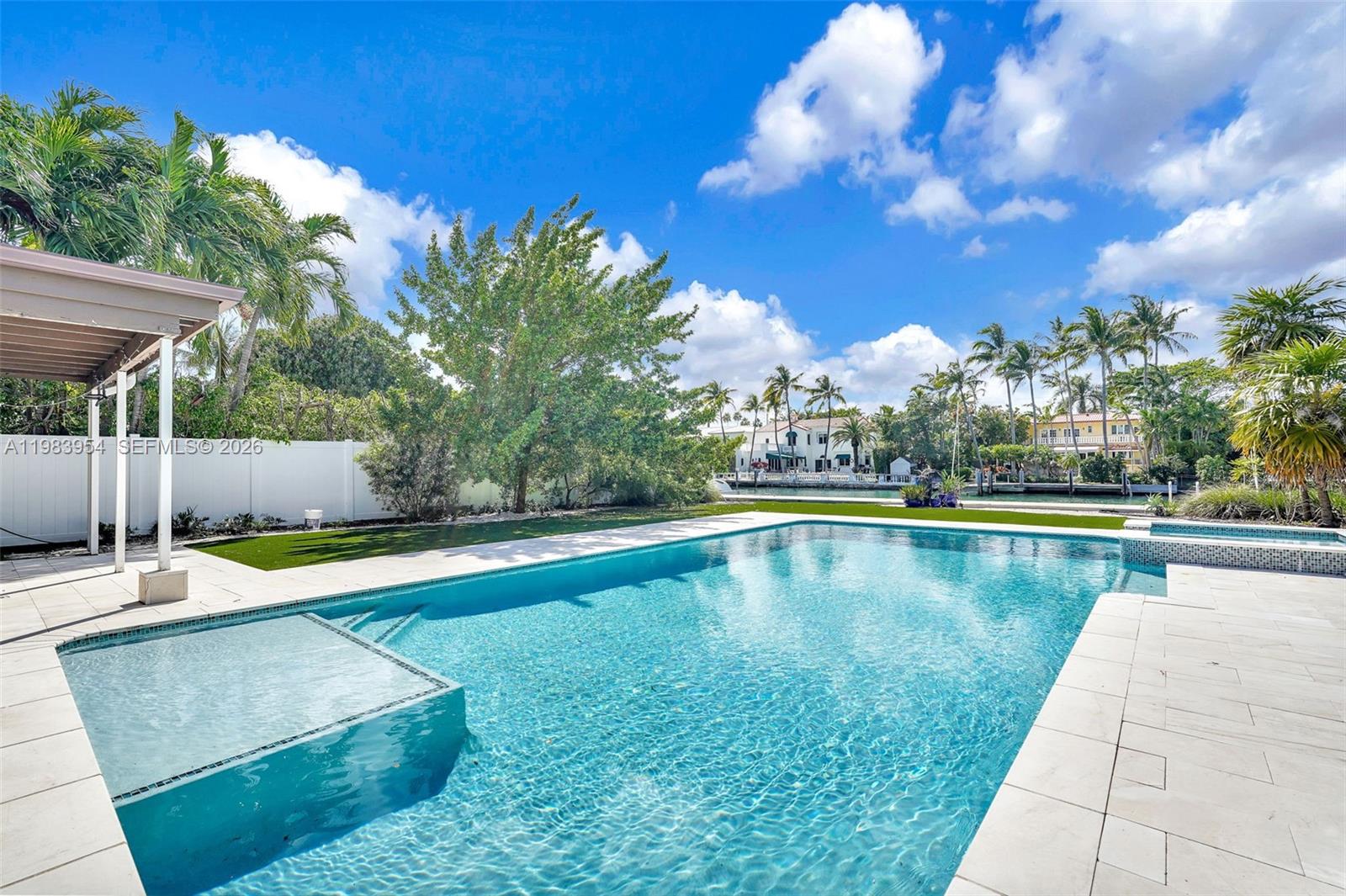 4560 Prairie Avenue Miami Beach, FL 33140 - Photo 3 of 15 a view of a swimming pool with lounge chair