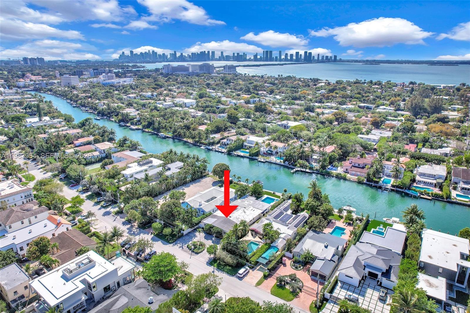 4560 Prairie Avenue Miami Beach, FL 33140 - Photo 5 of 15 an aerial view of residential houses with outdoor space and lake view