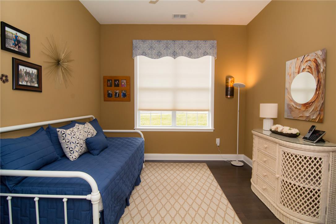 4097 Rutz Lane Allentown, PA 18104 - Photo 38 of 59 Rich hardwood flooring complements the warm-toned walls and large window of this versatile room.