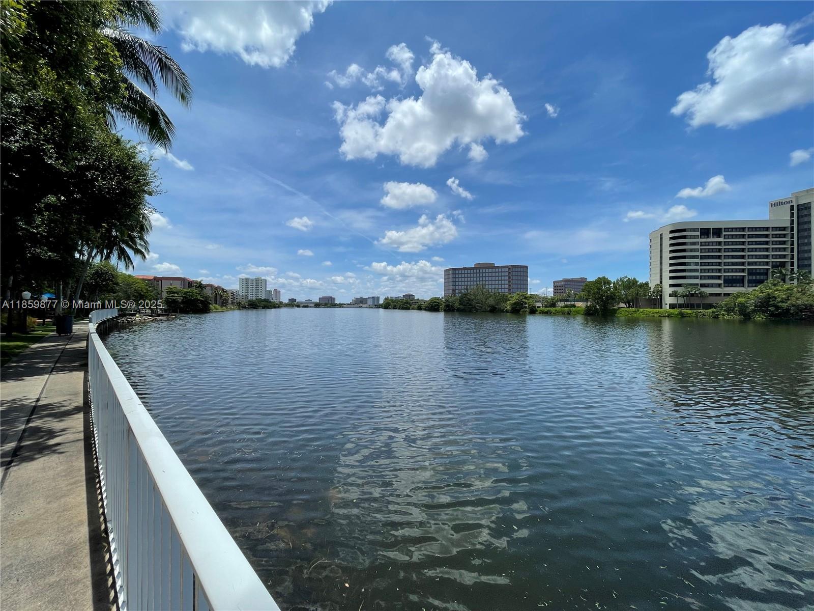5085 Northwest 7th Street, Unit 1203 Miami, FL 33126 - Photo 26 of 26 a view of a lake with a terrace